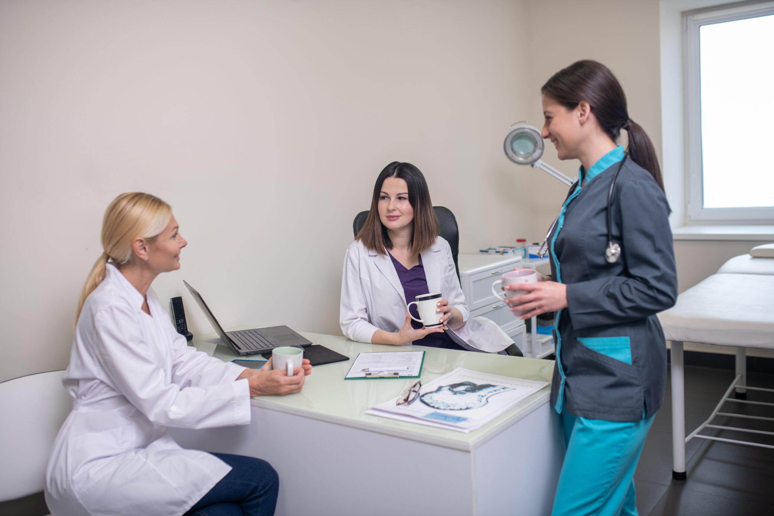 After shift. Doctors in neurologycal clinic feeling good talking after the shift